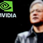 Nvidia CEO (Jensen Huang) in front of Nvidia logo